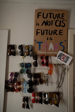 Sunglasses and a placard in Bella's apartment. Originally from the southern Turkish city of Adana, Bella was a familiar face at the recently-banned Istanbul Pride marches and at demonstrations support...