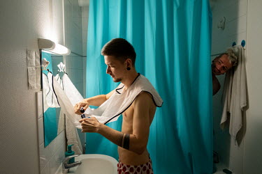 Sergi (right) and Igor in their bathroom.Faced with increasing levels of abuse in their hometown of Odessa along Ukraine's southern Black Sea coastline, Igor and his boyfriend Sergi decided it was tim...