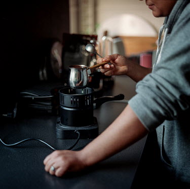 Wael making traditional Moroccan coffee in his apartment.Wael, who is intersex, is registered as female on official documents in his home country of Morocco, but identifies as a transgender man. Becau...