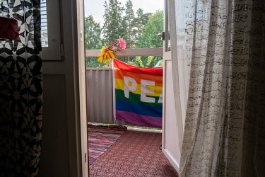 A rainbow flag on the balcony of Bella's apartment.Originally from the southern Turkish city of Adana, Bella was a familiar face at the recently-banned Istanbul Pride marches and at demonstrations sup...