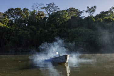 A Kayapo surveillance team prepares a boat to monitor the Pixaxa River from one of the territorial monitoring bases of Bau village, in the Bau Indigenous Territory. The inhabitants of Bau village make...
