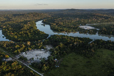 An aerial view of Bau village (left) and Kamau village (right) which are separated by the Curua river which runs through the Indigenous Land of Bau and whose waters are contaminated by pollutants from...