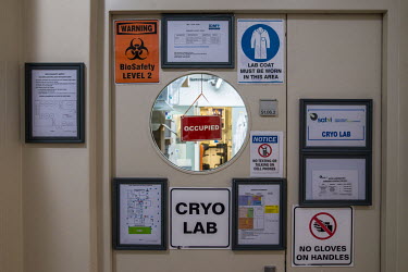 Warning signs on the door to the CRYO Laboratory at the University of Cape Town's Medical campus where the blood sera of TB patients are stored.