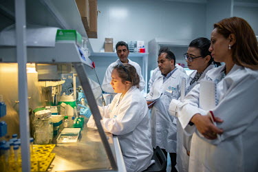Scientist Francis Lees gives a demonstration on mRNA formulation to a team of visiting scientists from the Tunisian Institute Pasteur, at the Afrigen Biologics and Vaccines R&D laboratory. The delgati...