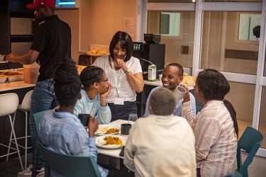 Afrigen's Executive Director, Caryn Fenner, chats with staff in the canteen during lunchbreak at the company's headquarters.