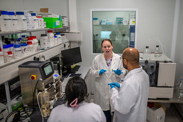 Afrigen staff (left to right) Eden Padayachwe, Tanja Smith and Brnadon Weber troubleshoot issues with a Tangential Flow Filtration Machine in the R&D lab at company headquarters in Cape Town. The mach...