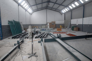 A warehouse with construction equipment that will be a part of the expanded vaccine production facility of Afrigen Biologics.