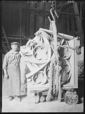 This is probably a stonemason from the Fondation de l'Oeuvre Notre-Dame posing in front of the narthex, a small rose above the portal. Photo taken between 1890 and 1920.~~( Archive Pictures © Fondati...