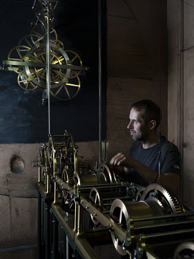 Horologist Ludovic Faullimel with part of Strasbourg Cathedral astronomical clock. Each week Faullimel attends the cathedral in order to wind up the mechanism, which dates from 1842.