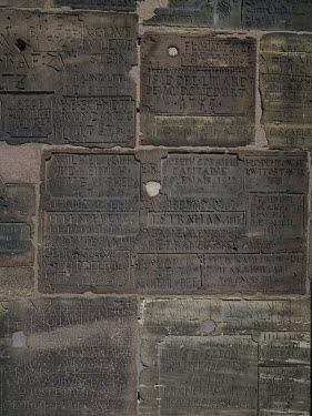 Names cut into the stone walls of Strasbourg Cathedral, including the poet Johann Wolfgang von Goethe. The practice of name carving was especially popular between the 16th and 19th centuries when guar...