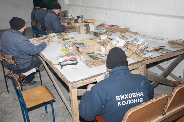 Russian prisoners of war making paper bags. The camp authorities say the work is paid, and they can use their salary to buy things at a local store or for an extra phone call.