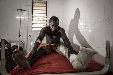 Komlanvi Aluka (32) a patient in Sylvanus Olympio hospital where he is being treated for injuries sustained in a motorcycle accident.As motorcycle ownership in sub-Saharan Africa has grown from less t...