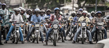 Motorcyclists on a busy road. The vehicles are helping to propell Togo's economic growth, with UN data revealing that 300,000 were imported in 2020 alone.As motorcycle ownership in sub-Saharan Africa...