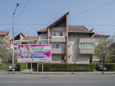 A billboard advertisment for work in a video-chat studio, promising daily earnings of between 300 and 800 RON (approx. between 66 and 178 euros). In Romania the industry is unregulated and has grown s...