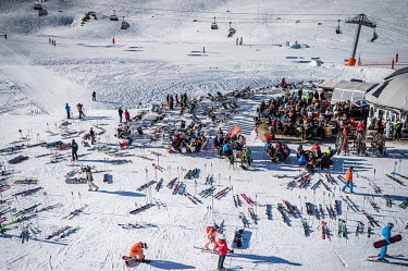 A crowded bar in the ski area where many winter sports enthusiasts are gathered for some food or drink.In order to keep a ski area profitable, resorts are fully committed to attracting more tourists a...