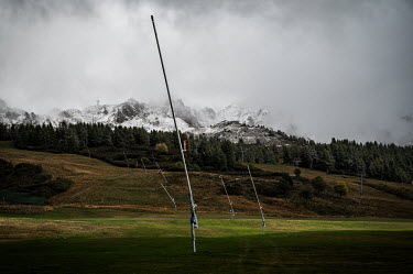 Snow lances along a ski slopes. In the low season it is striking how many of these lances are lost in the landscape.