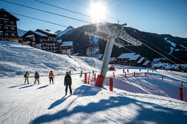 People on a ski slope during the winter season.To attract more tourists, ski resorts are expanding their offerings beyond traditional skiing activities to include a wider range of winter sports and ot...