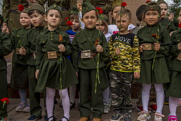 Before leaving for their summer holidays, school children gather under the statue of a World War II heroine on Remembrance Day. According to Roberto J. Carmack, in ^Kazakhstan in World War II^, when t...