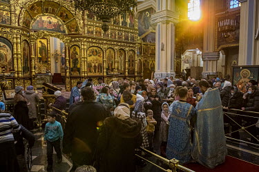 The Eucharist during Sunday service in the Russian Orthodox Ascension Cathedral in Panfilov Park, also named the Zenkov Cathedral after its architect. Built between 1904 and 1907, it has the particula...