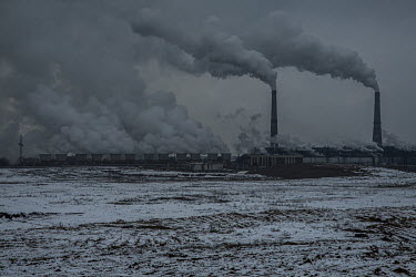 Smoke rises from chimney stacks at a coal-fired power plant. For many years, according to figures from the Ministry of Ecology, air pollution has been high in Almaty, mainly due to the burning of poor...