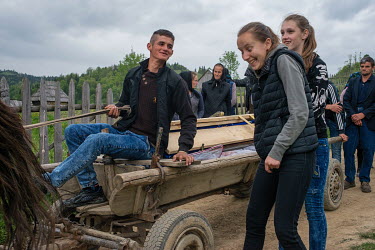 For the young people this is also an occasion to socialise. Horse pulled carriage is transporting the body of Miron Ghibus, deceased at 82 years old. He has been living and working in the forest the e...