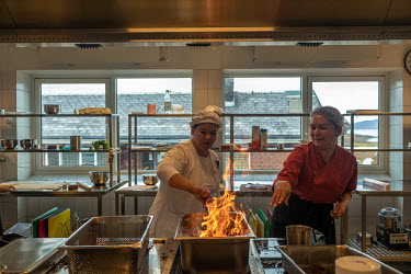 Student chefs smoking whale meat at Inuili, a culinary school in Narsaq. The school takes students of all ages, from across the country, and advocates for new ways of making traditional Greenlandic fo...