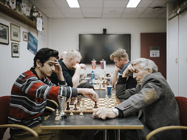 Russian and Norwegian residents playing a chess tournament.