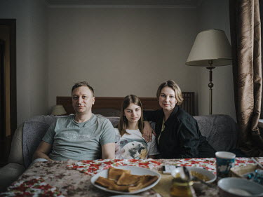 Tatyana, her husband Alexander and their daughter, originally from eastern Ukraine, who have lived in Barentsburg for five years. According to Tatyana ^The ordinary people suffer the most from war, no...
