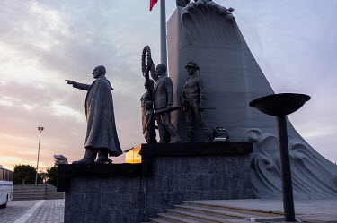 A statue of Mustafa Kemal Ataturk on the seafront, surrounded by waves and soldiers, raised to mark independence of the Turkish Republic. Ataturk is pointing to the city of Izmir.