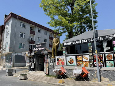 A large statue of Mustafa Kemal Ataturk above the entrance of a restaurant in Acibadem.