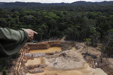 Members of the Special Enforcement Group (GEF) of the IBAMA ( Brazilian Environmental Protection Agency ) land by helicopter in order to destroy machinery in an illegal mining operation in the Yanomam...