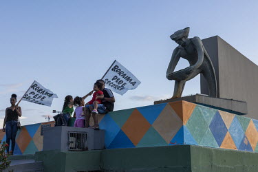 Pro-mining ( garimpo ) protesters pose for a photograph in front of the Garimpeiro ( gold digger ) Monument in downtown Boa Vista. Mining is the main economic activity in the state of Roraima and ther...