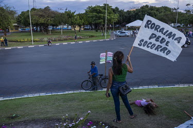 Pro-mining ( garimpo ) protesters in front of the Garimpeiro ( gold digger ) Monument in downtown Boa Vista. Mining is the main economic activity in the state of Roraima and therefore has strong popul...