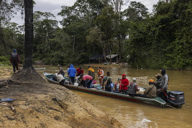 Miners ( garimpeiros ) disembark a boat at a clandestine port on the banks of the Uraricoera River after fleeing the Yanomami Indigenous Land following a crackdown by the new government. Since the beg...
