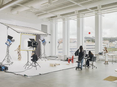A photoshoot takes place in the studios at the headquarters of multinational clothing company Inditex.