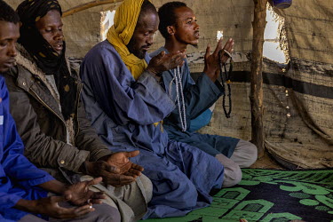 Fulani who fled an attack in the Bankass circle say prayers in a tent in Mopti.
