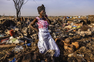 A woman who lost everything in one of the many fires that have broken out in the Faladie camp for displaced persons where 3,600 people are crammed together after fleeing attacks in the centre of the c...