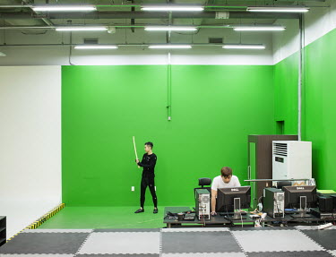 Nexon staff making a videogame in a motion room located in the headquarters of Nexon, among the largest Korean producers of online games. The motion room is where the real body's movements are recorde...