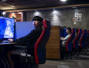 Teenagers playing online games in a PC bang, a type of LAN gaming centre and internet cafe, in the Hongik University area.