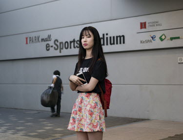 A supporter of an Esports team at the entrance of the Yongsan e-sports stadium. Stitched photograph