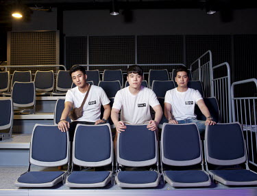 A team of professional gamers after a competition at the Nexon Arean e-sports stadium. Stitched photograph