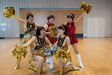 Fumie Takino (90) founder and the elderst member of the senior cheer squad called 'Japan Pom Pom', with other members at a weekly practice session.~~^I didn't start cheerleading for health reasons but...