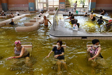 Women using a pool for exercises at the Kadokawa Care Prevention Centre, a facility specialising in long-term care established in 2011 with the aim of extending the healthy life expectancy of the elde...