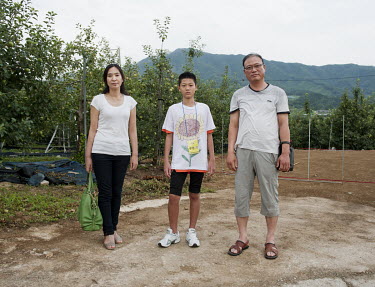 A 14-year-old patient with his parents outside at the National Center for Youth Internet Addiction Treatment, commissioned by Ministry of Gender Equality & Family, where the boy, who has been diagnose...