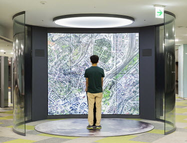 A student using a Google-earth installation at the Kwanjeong Library of the Seoul National University. Stitched photograph