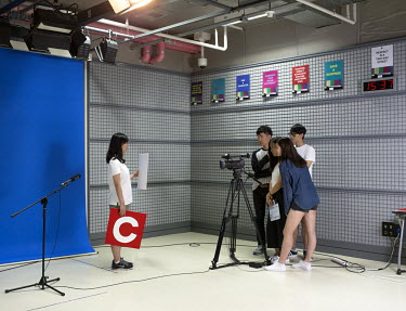 A group of 14-year-old students recording videos for the presentation of their homework in the Chadwick International School's digital studio.
