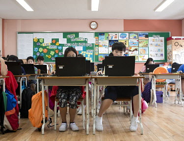 A classroom of pupils working from laptops during lesson at the Itaewon Elementary school.