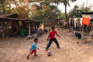 Two-year-old Voeun Panha, who was born with clubfoot, plays football with his brother, Voeun Sovanmesa (10).Clubfoot, a condition that causes one or both feet to be twisted severely inwards, is the wo...