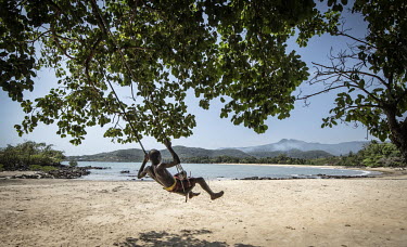 A child plays on Black Johnson Beach, south of Freetown. The beach is being developed as a port for Chinese fishing boats.In Sierra Leone, businesses are taking advantage of poor legislation, feeble e...