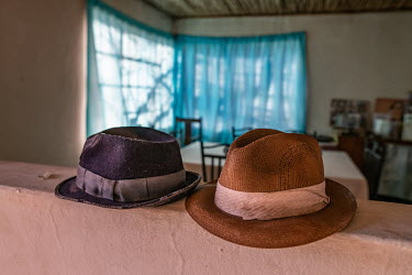 Hats lie on a counter in the cottage of Oom Kosie and Anna Salomo, an indigenous Khoisan couple whose family have been harvesting rooibos in the area for generations. Now 89 and 84 years old respectiv...